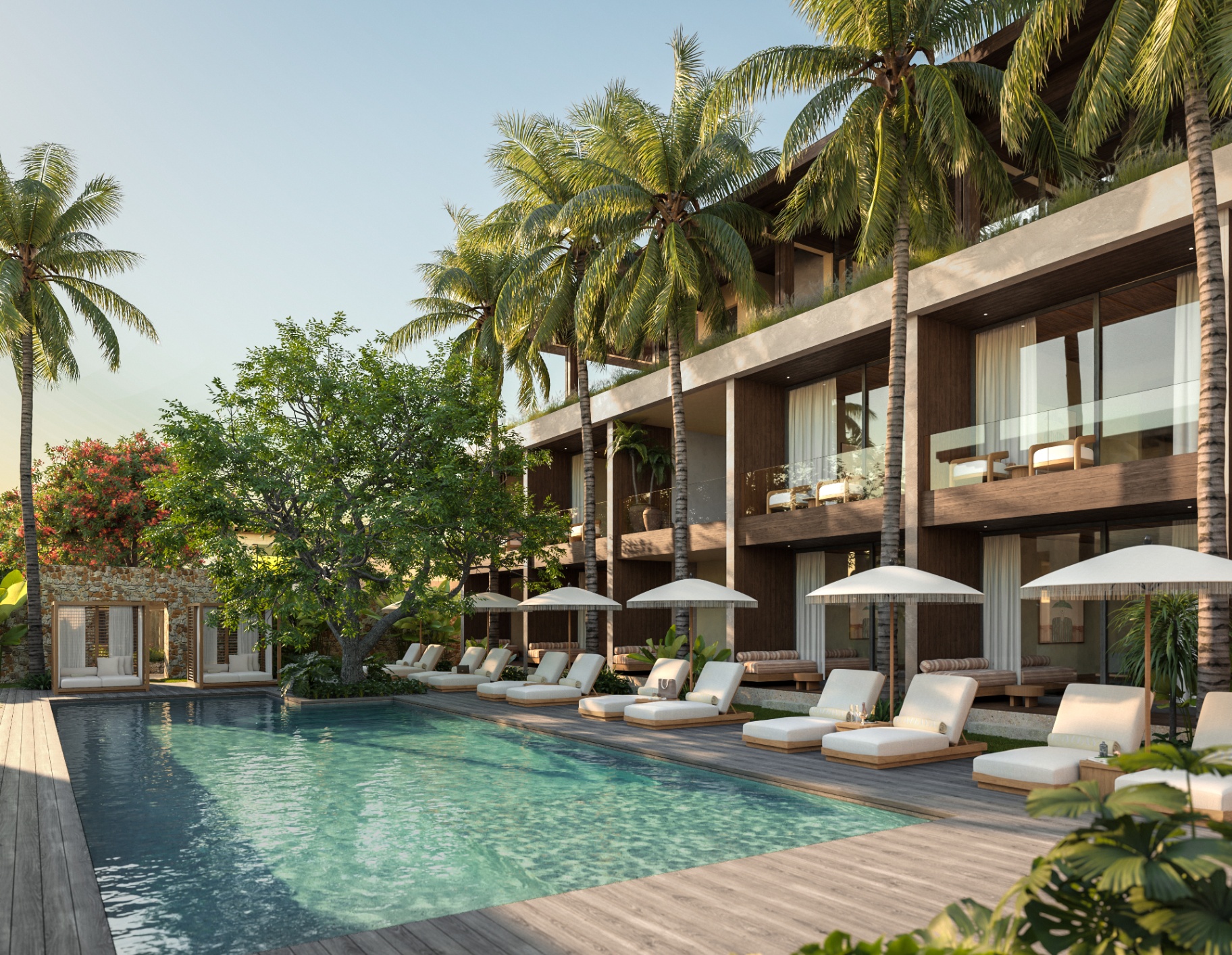 Kahaya resort poolside with sunbeds and palm trees